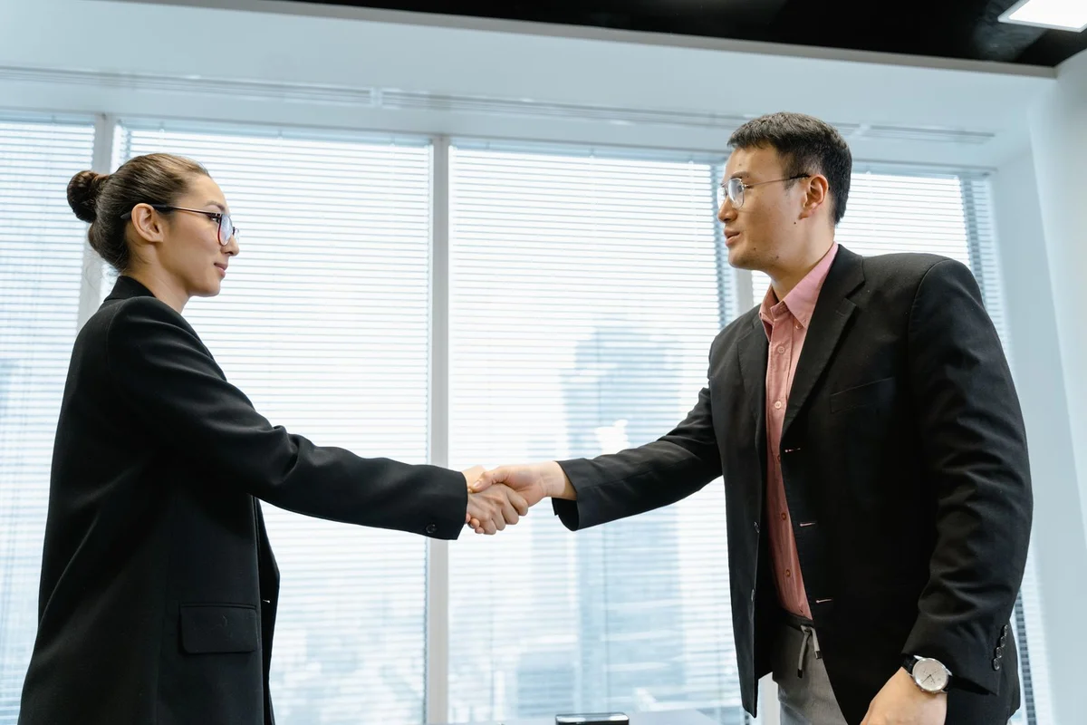 Business professionals shaking hands, a stock illustration of collaboration